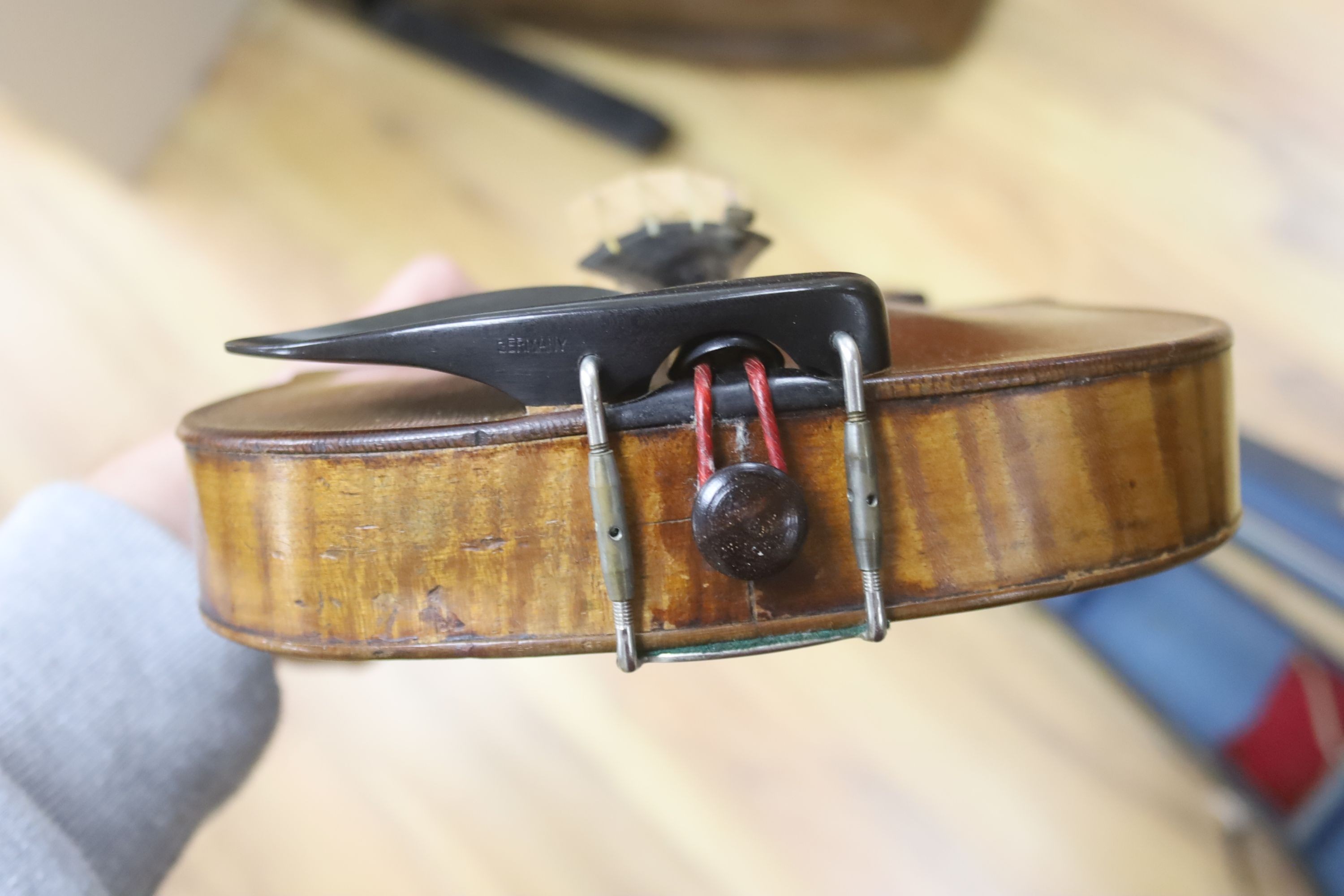 A cased violin and bow